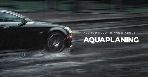 The article title over an out of focus car aquaplaning in the rain.